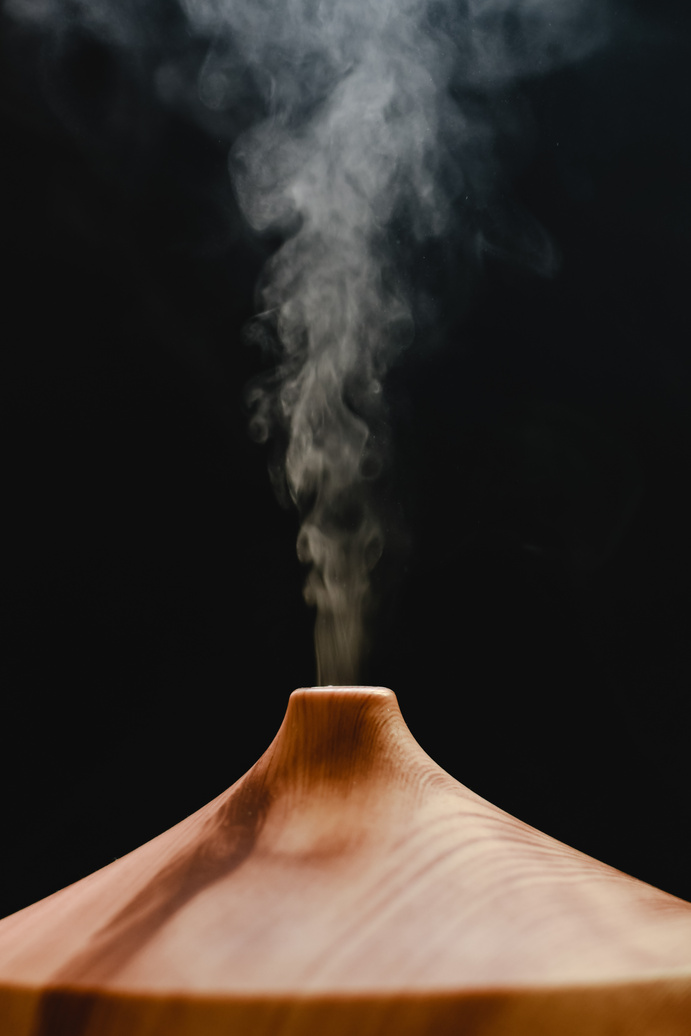 White Steam Coming Out from a Wooden Diffuser